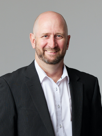 Portrait of Kyle Kemp, director at PCC